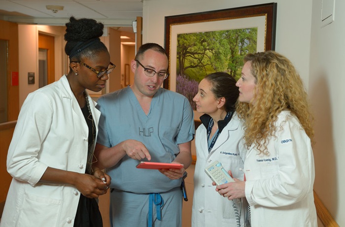 Residents looking at an Ipad
